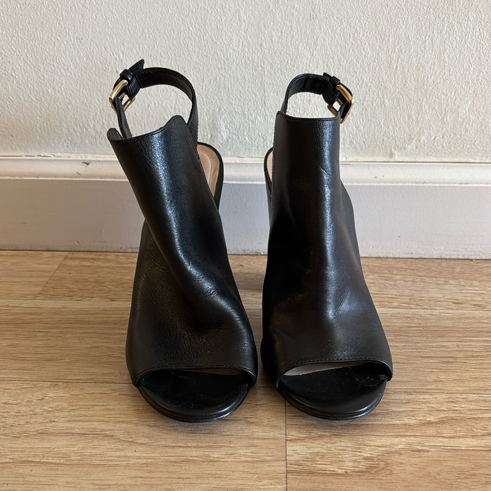 Also Round open-toe mules with slingback and buckle closure